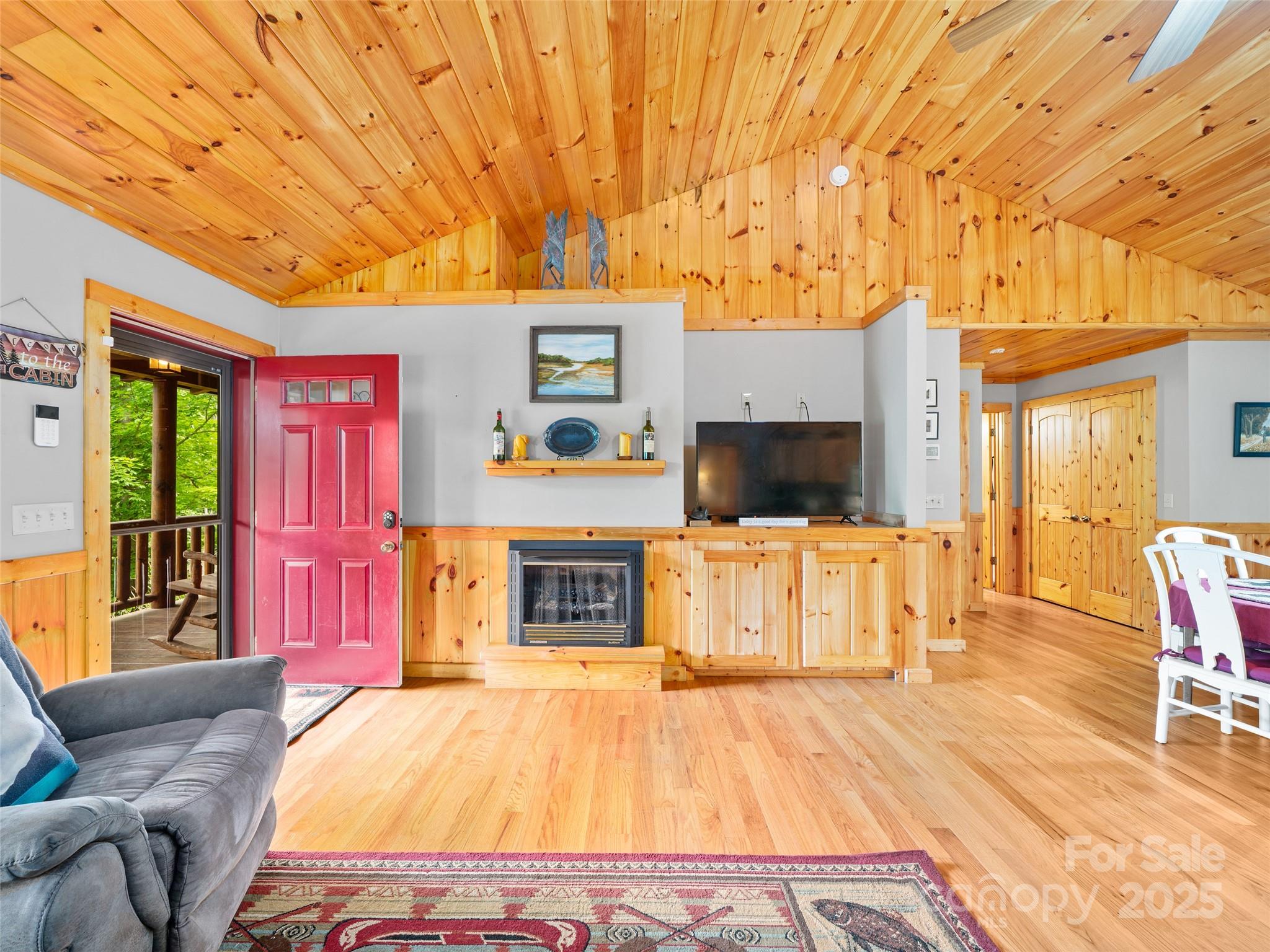 198 Grace Ridge Road Bakersville, NC 28705 - Photo 7 of 27 a spacious bedroom with a bed and a couch