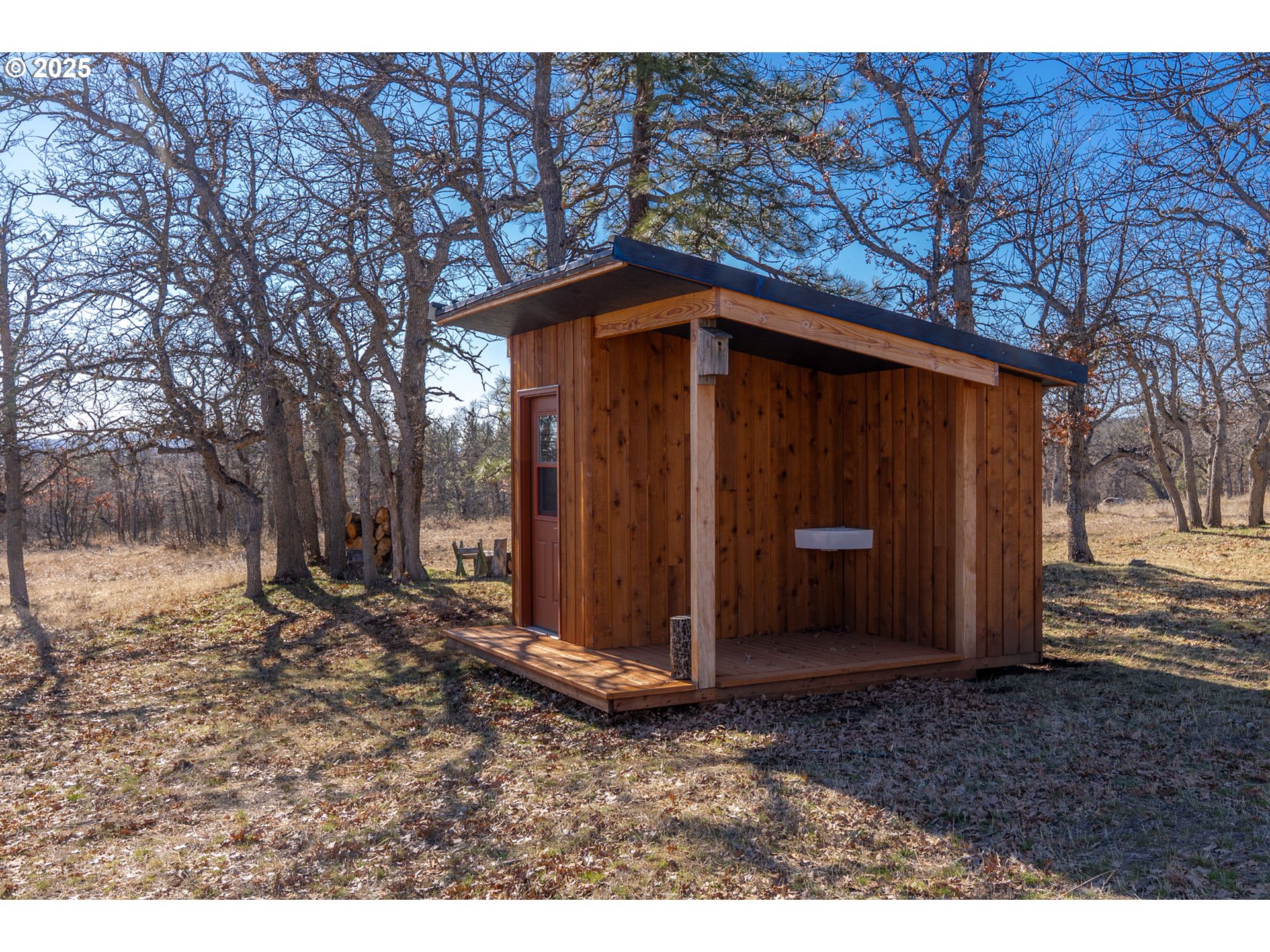 76 Big Springs Road Goldendale, WA 98620 - Photo 23 of 48 a view of a barn in the middle of a yard