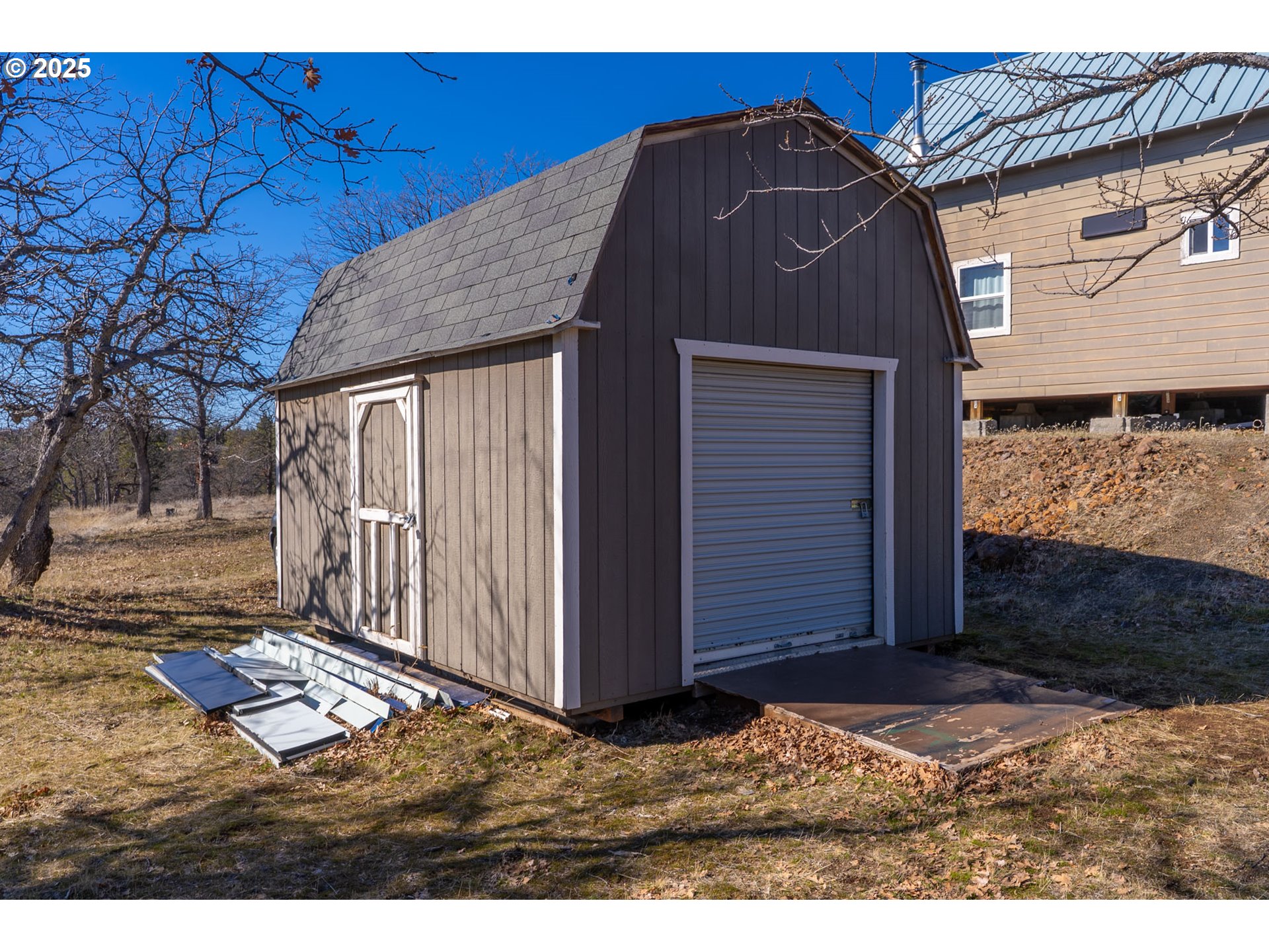 76 Big Springs Road Goldendale, WA 98620 - Photo 26 of 48 a side view of a house with a door