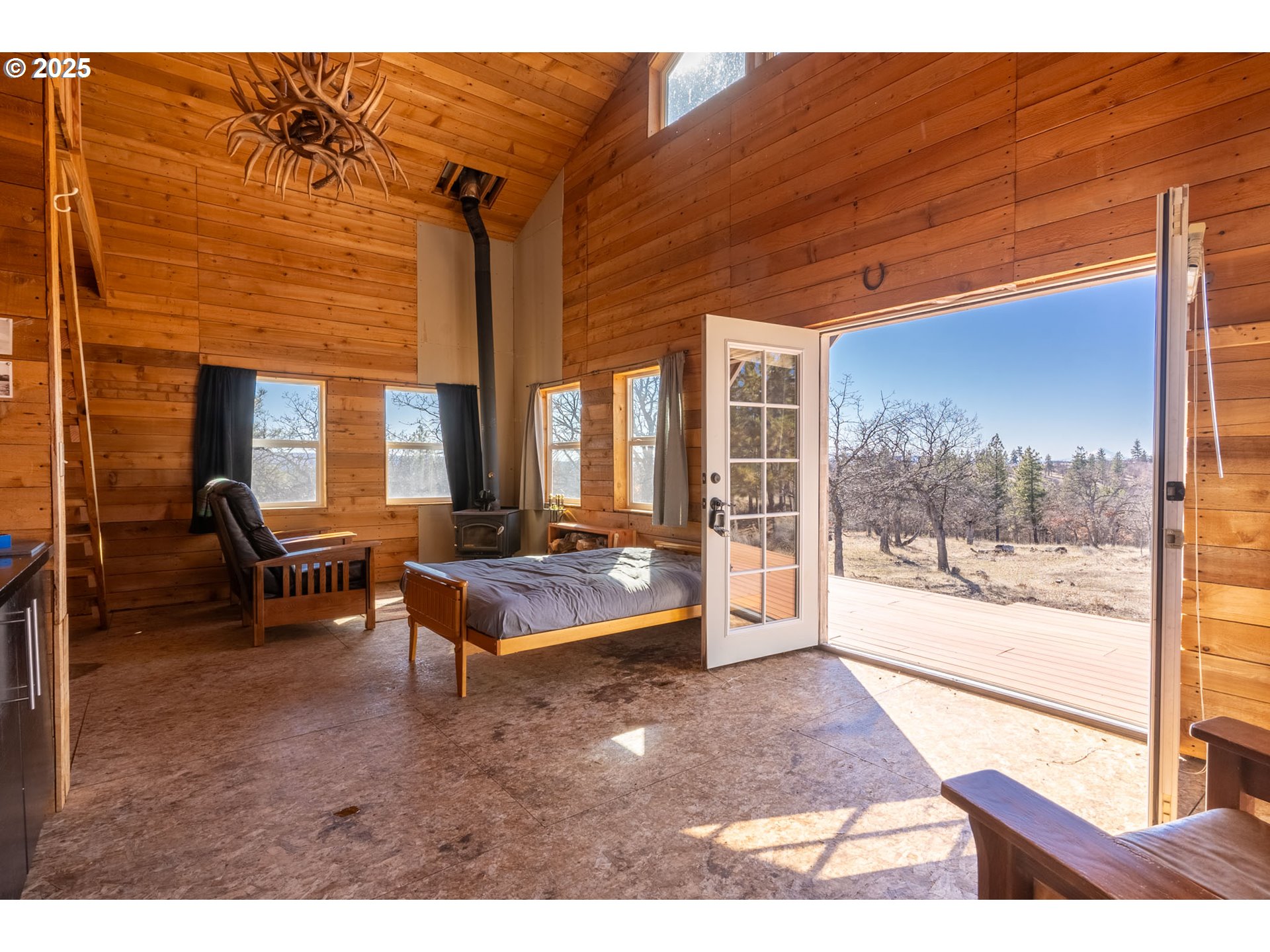 76 Big Springs Road Goldendale, WA 98620 - Photo 4 of 48 a living room with furniture and a floor to ceiling window