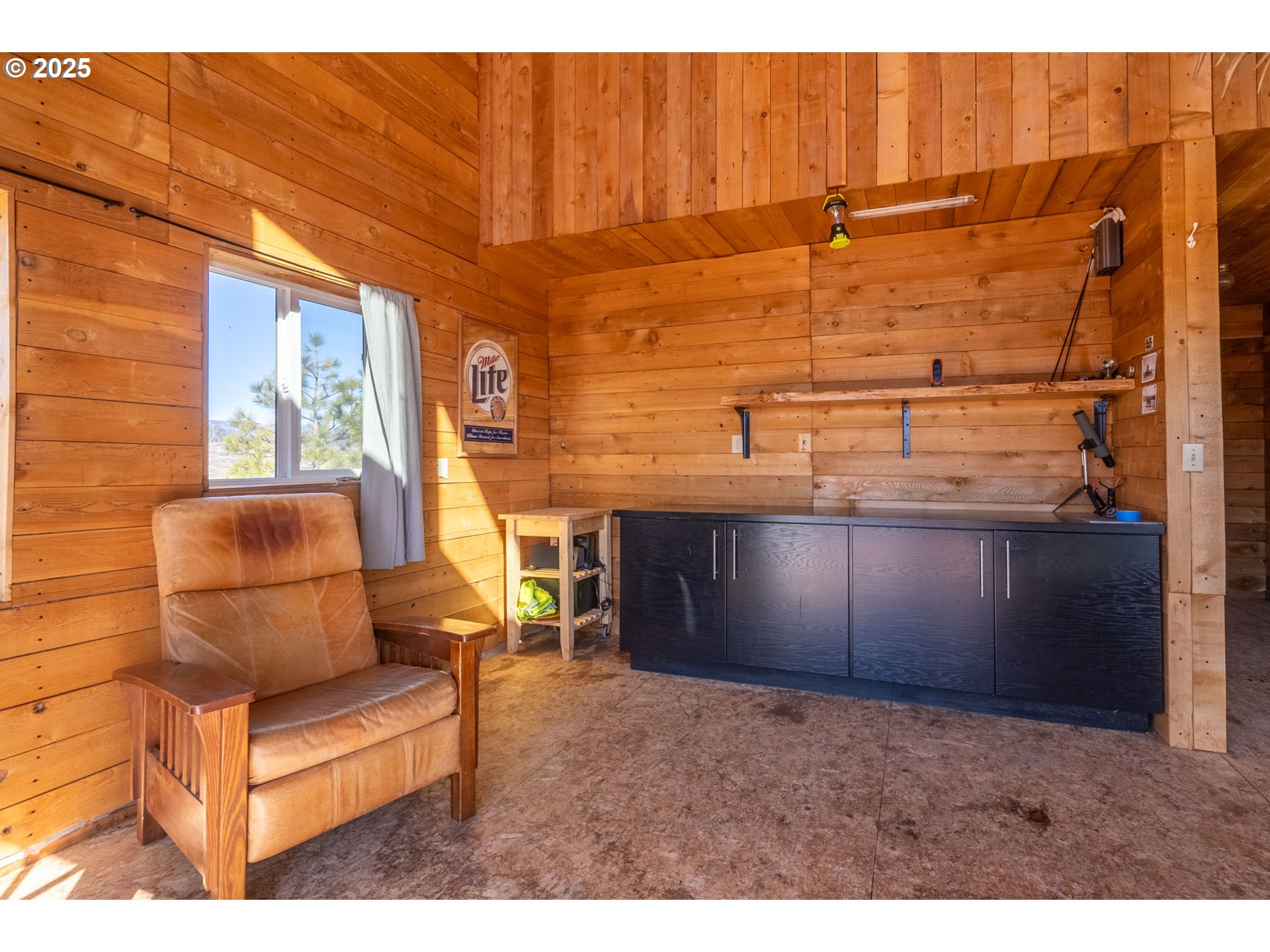 76 Big Springs Road Goldendale, WA 98620 - Photo 6 of 48 a view of a couches with wooden walls