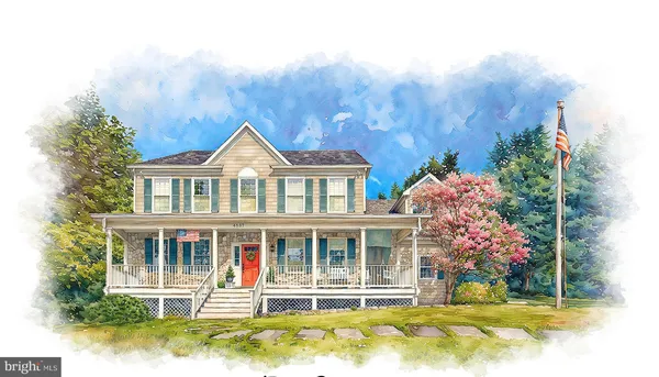 a front view of a house with a yard table and chairs