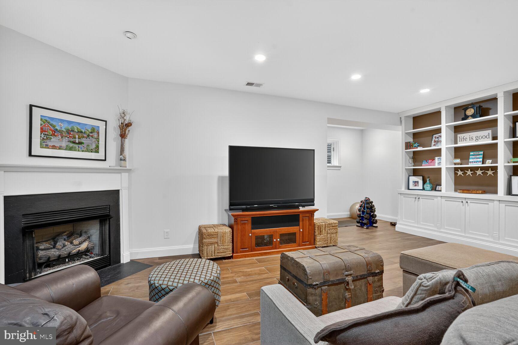 4837 W Street Northwest Washington, DC 20007 - Photo 42 of 59 Family rm with gas fireplace and wall of built-ins