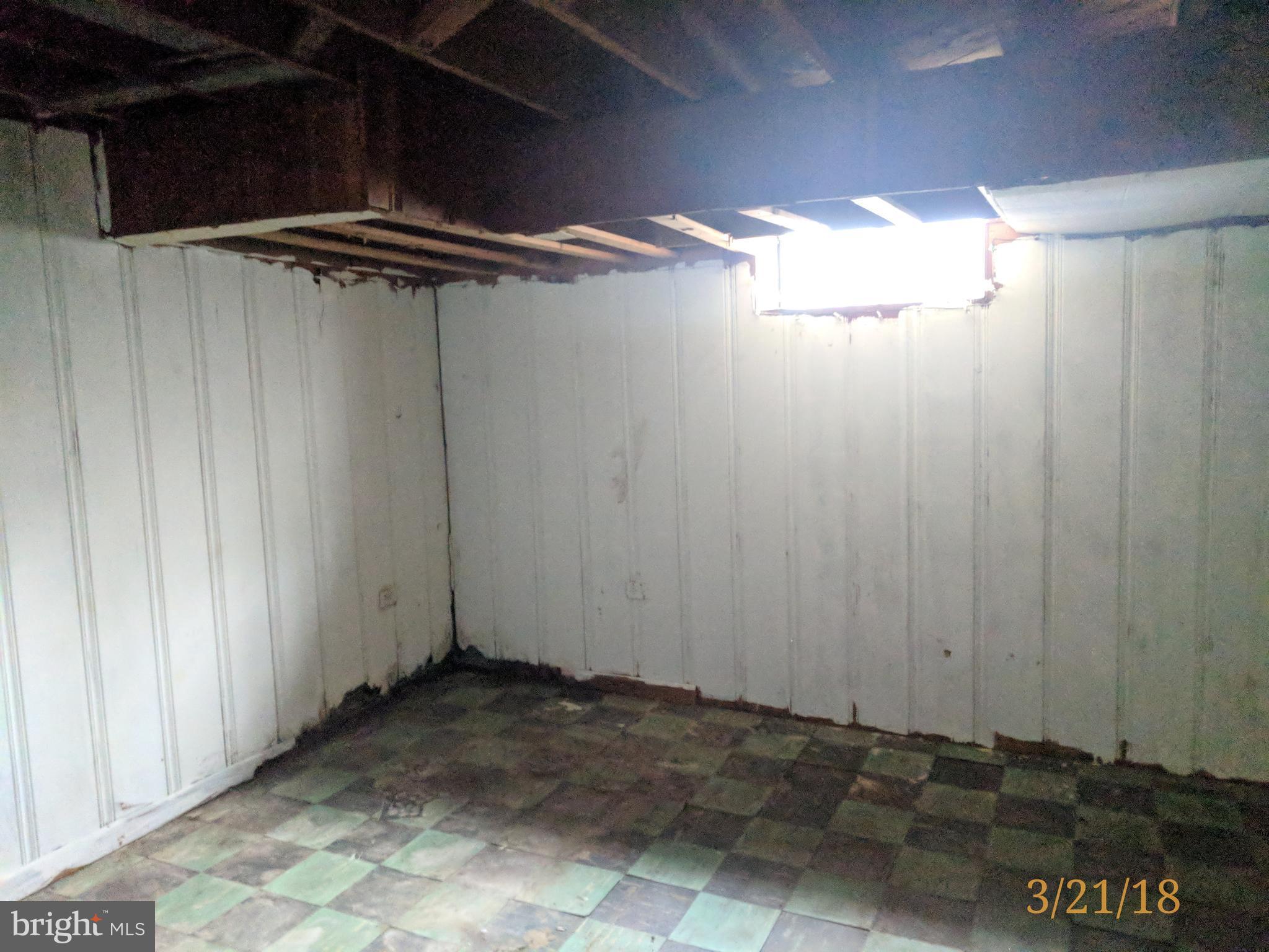 4452 Scotia Road Baltimore, MD 21227 - Photo 11 of 20 a view of a room with wooden walls