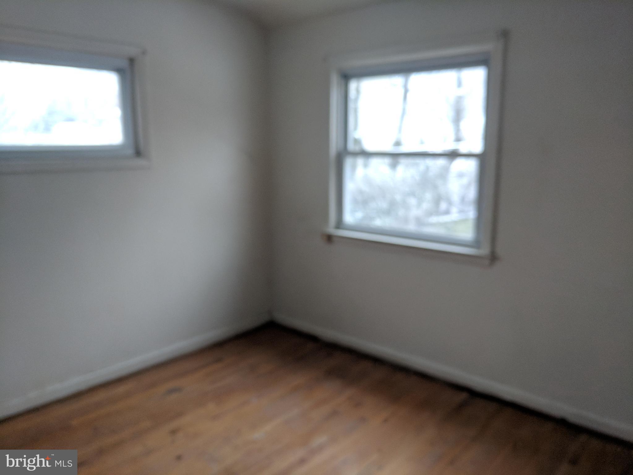 4452 Scotia Road Baltimore, MD 21227 - Photo 15 of 20 an empty room with a window