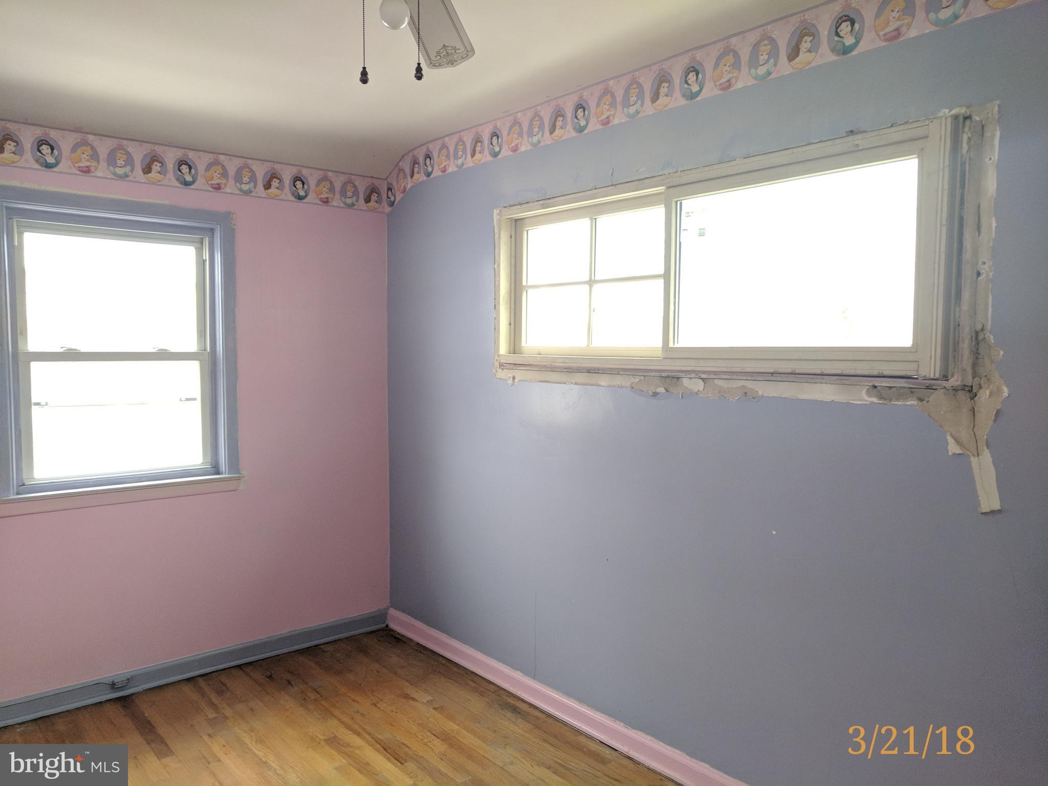 4452 Scotia Road Baltimore, MD 21227 - Photo 19 of 20 an empty room with a window