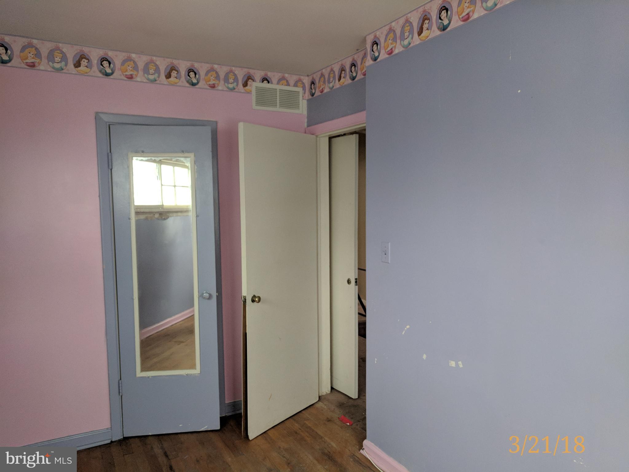 4452 Scotia Road Baltimore, MD 21227 - Photo 20 of 20 a view of a hallway with wooden floor and closet