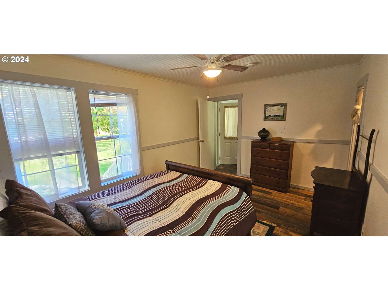 11354 Highway 36 Mapleton, OR 97453 - Photo 15 of 15 a bedroom with a bed window and a dresser