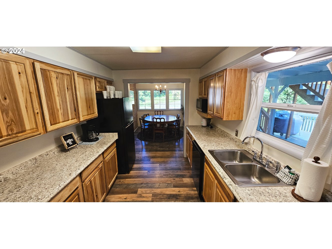 11354 Highway 36 Mapleton, OR 97453 - Photo 8 of 15 a kitchen with sink refrigerator and window