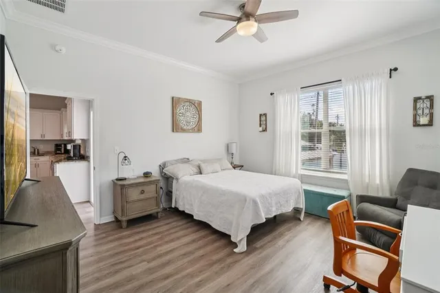 a bedroom with a bed and a chair