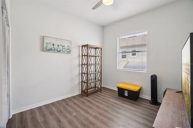 a balcony with furniture and potted plants