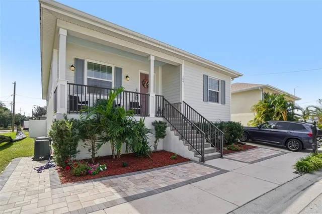 a front view of a house with garden