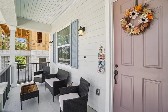 a view of a livingroom with furniture and flowers