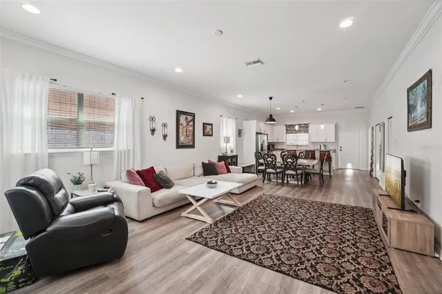 a living room with furniture or couch and a flat screen tv