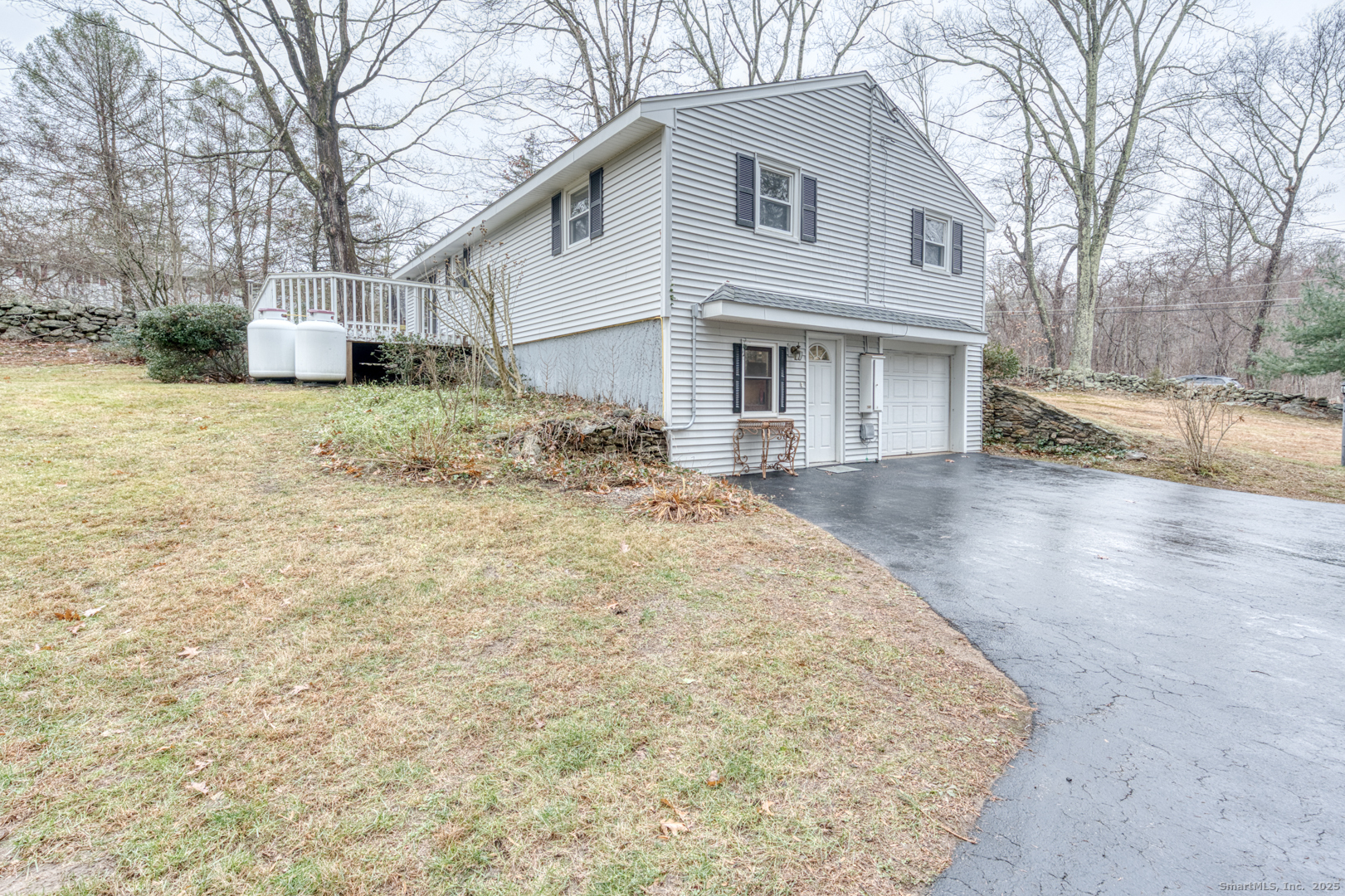 2 Doubleday Road Columbia, CT 06237 - Photo 1 of 1 View of Garage and Driveway with walkout basement