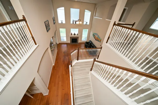 a view of entryway and hall with wooden floor