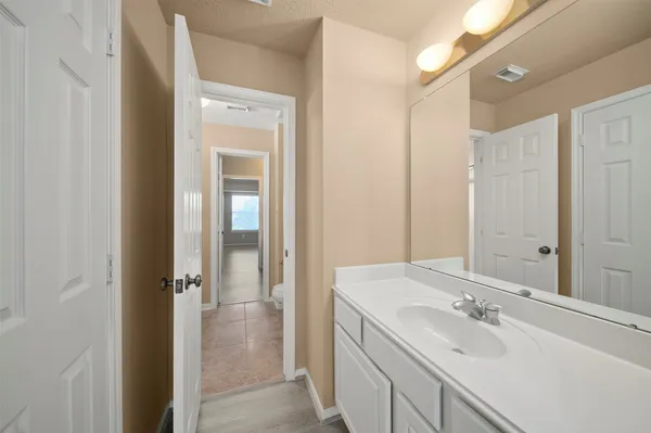 a bathroom with a sink a mirror and a shower