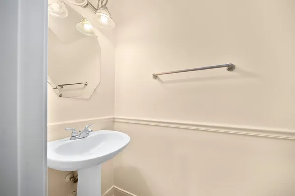 a bathroom with a sink a mirror and a shower