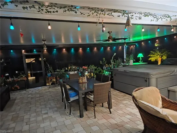 a view of a chairs and tables in patio