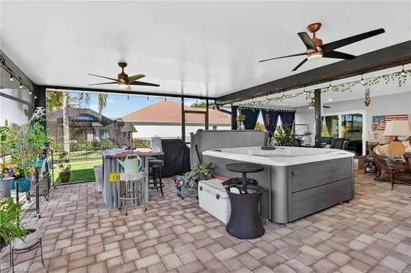 a view of a patio with a table and chairs
