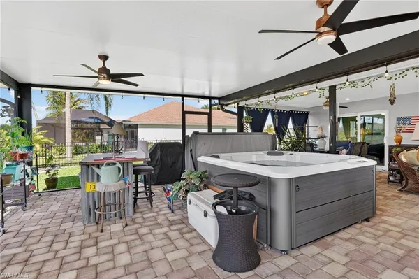 a kitchen with a sink a counter top space and stainless steel appliances