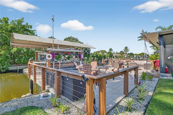 a view of a kitchen with a sink and dishwasher a stove