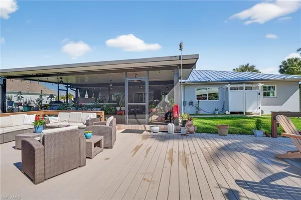 a view of a house with sitting area and furniture
