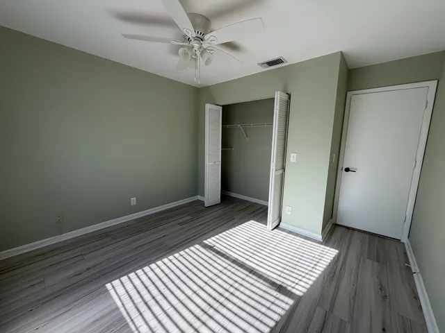 a white toilet sitting next to a bath tub and shower