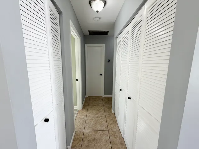 a bathroom with a toilet a sink and a mirror