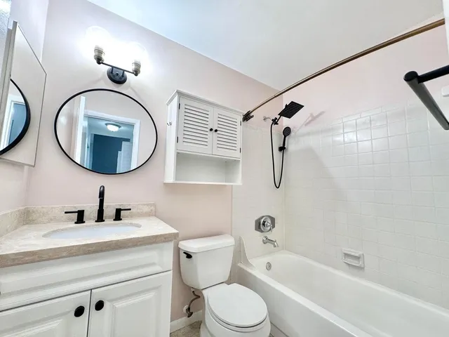 a bathroom with a shower and a toilet