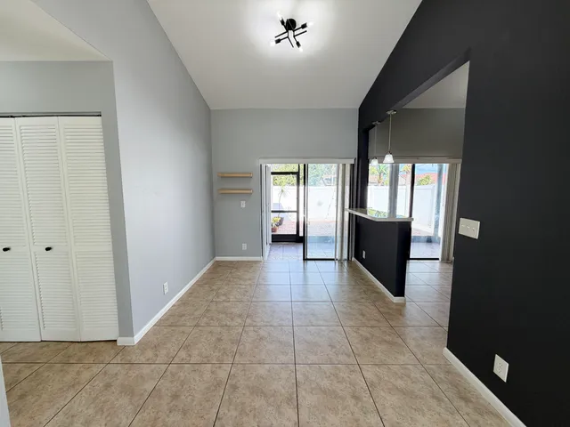 a view of an empty room with a fireplace