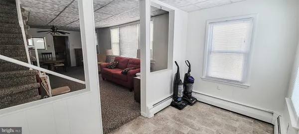 a view of living room with furniture and a window