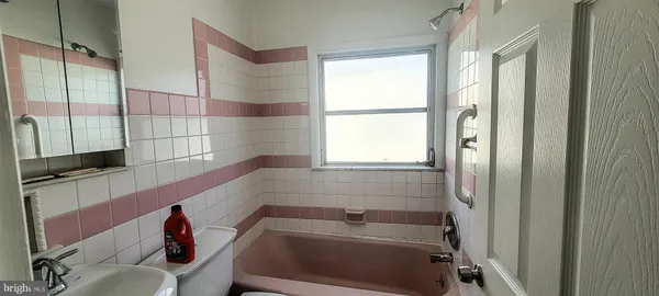 a bathroom with a sink and a bathtub