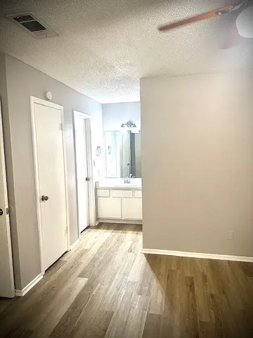 a view of a kitchen with wooden floor