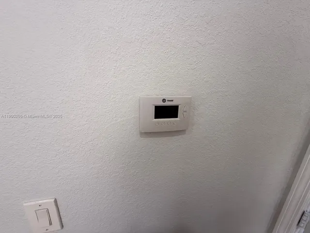 a wall with a potted plant on it