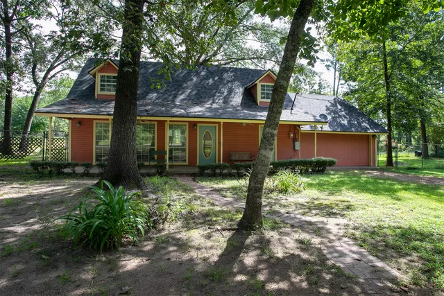 a view of a room with windows and wooden floor
