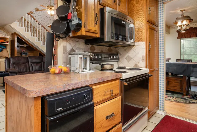 a living room with furniture rug and a large window