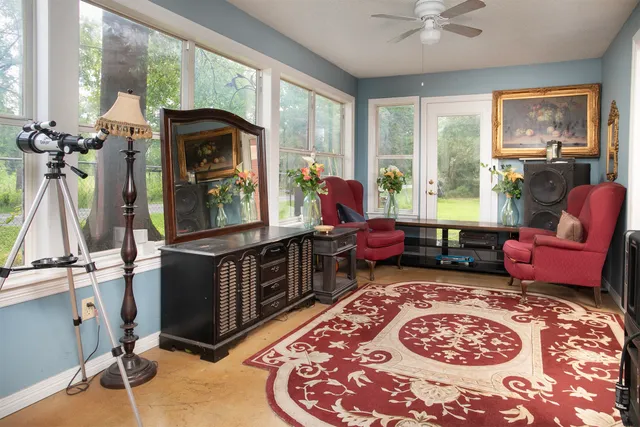 a living room with furniture and a rug