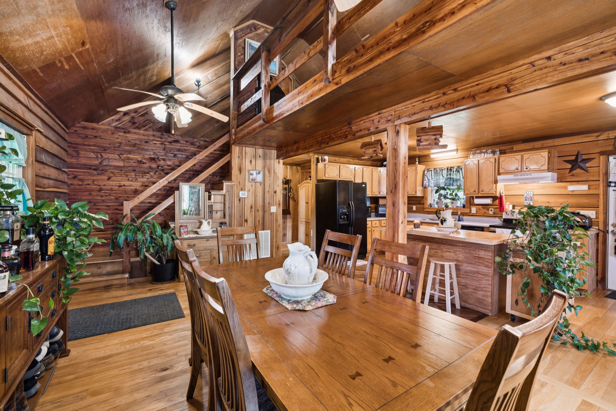 176 Robert Hensley Road Hohenwald, TN 38462 - Photo 11 of 53 a view of a dining room with furniture window and wooden floor