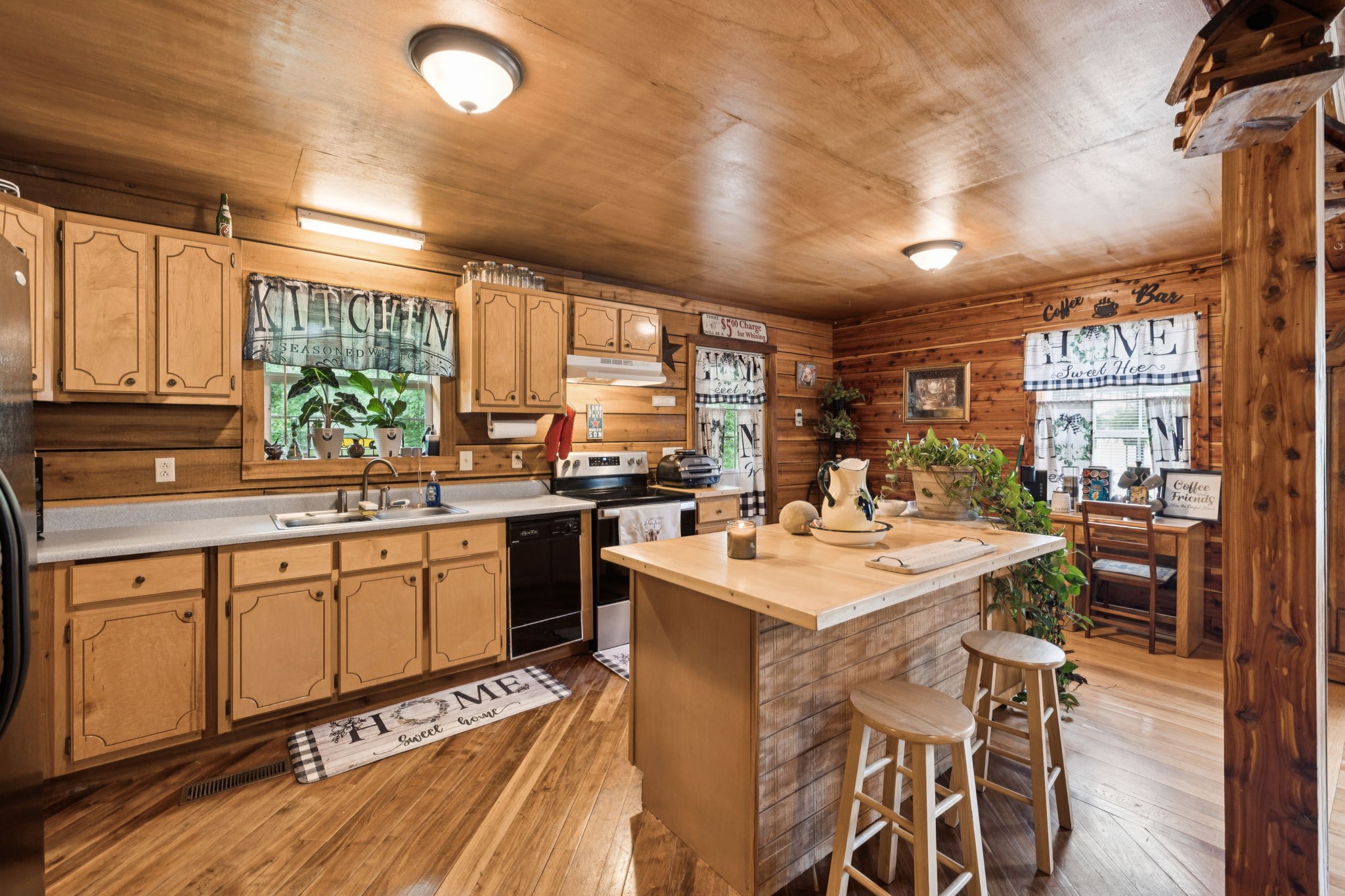 176 Robert Hensley Road Hohenwald, TN 38462 - Photo 14 of 53 a kitchen with a sink stove and cabinets