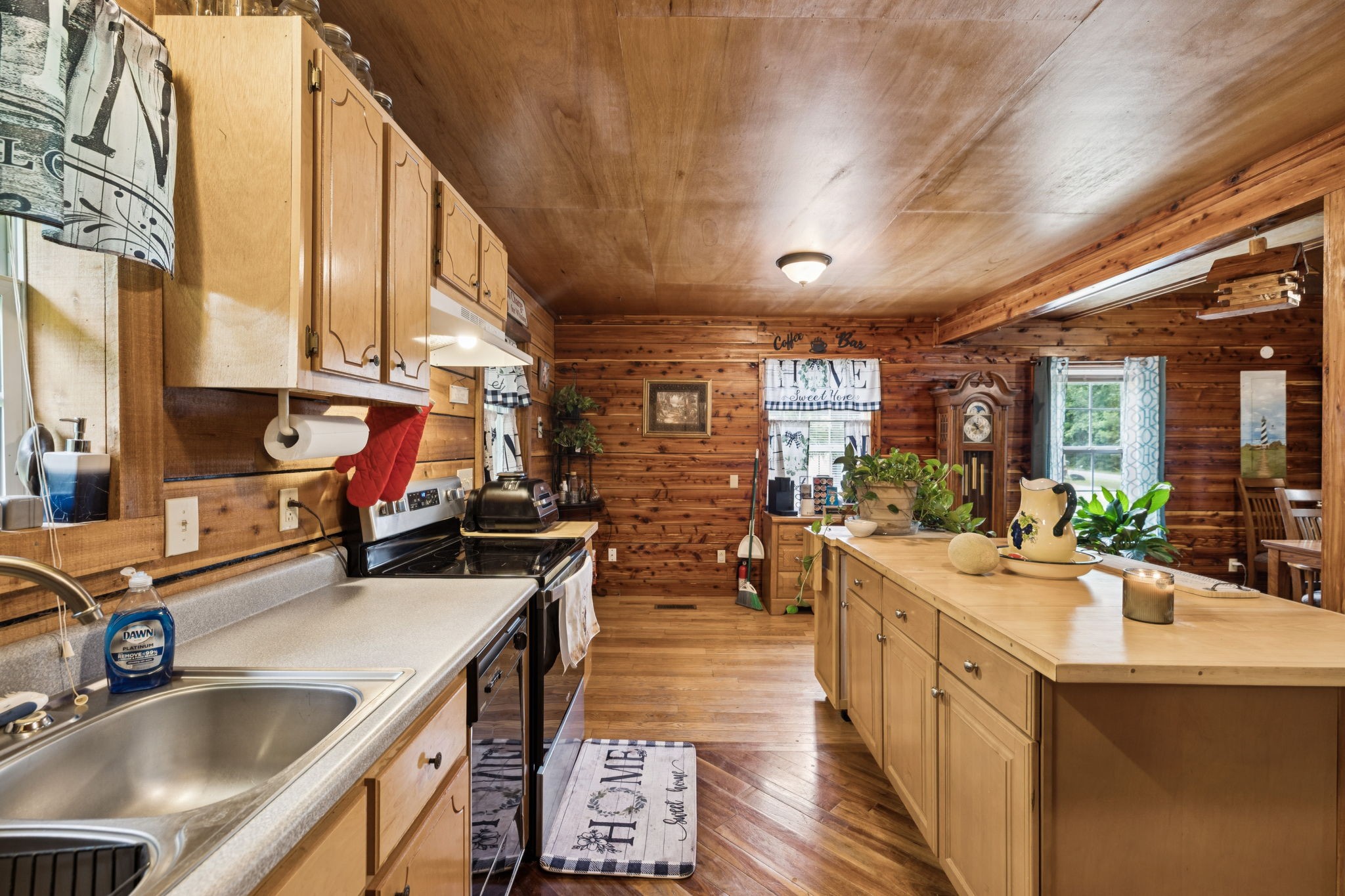 176 Robert Hensley Road Hohenwald, TN 38462 - Photo 16 of 53 a kitchen with sink stove and cabinets
