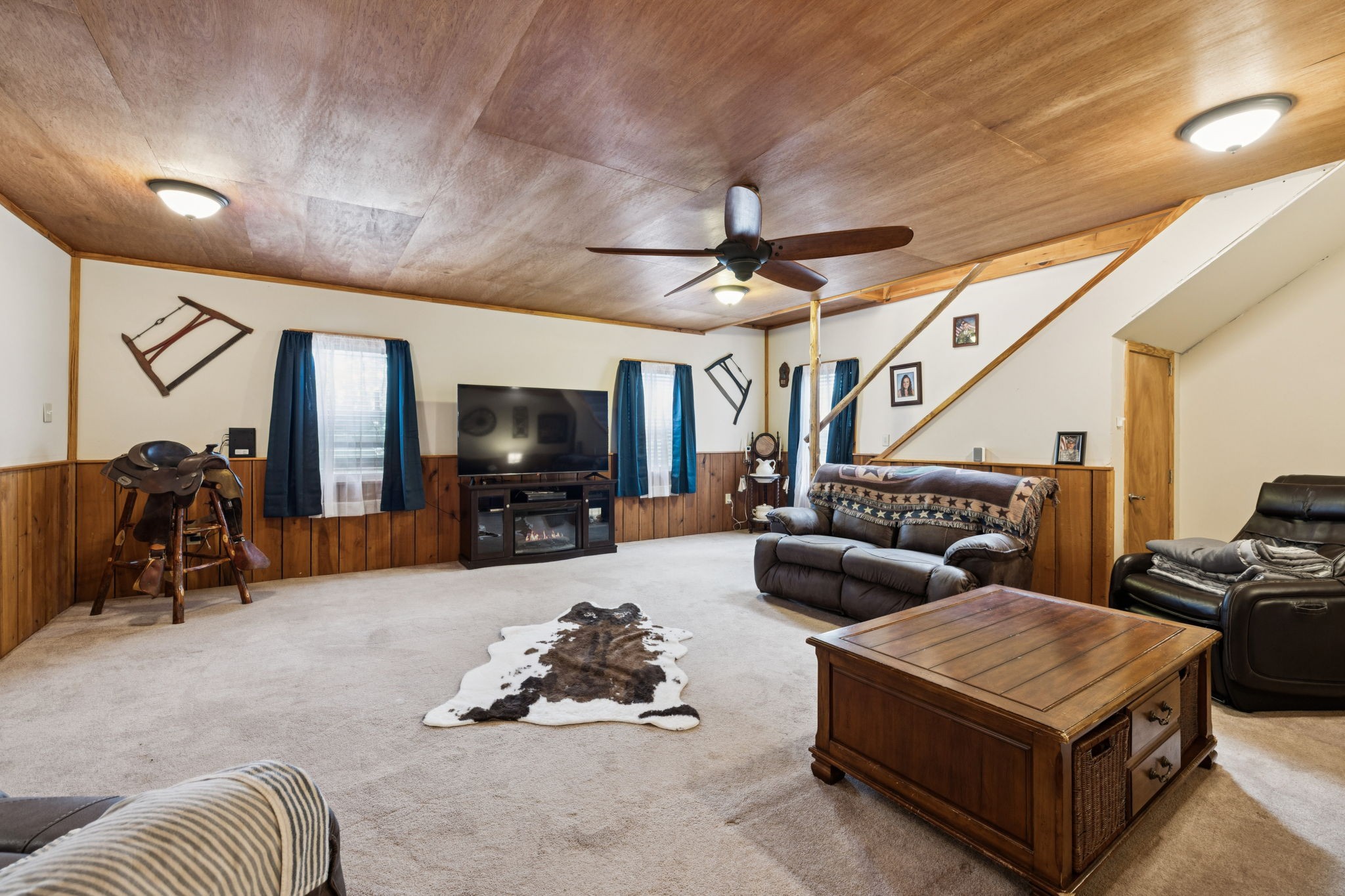 176 Robert Hensley Road Hohenwald, TN 38462 - Photo 19 of 53 a living room with furniture and a flat screen tv