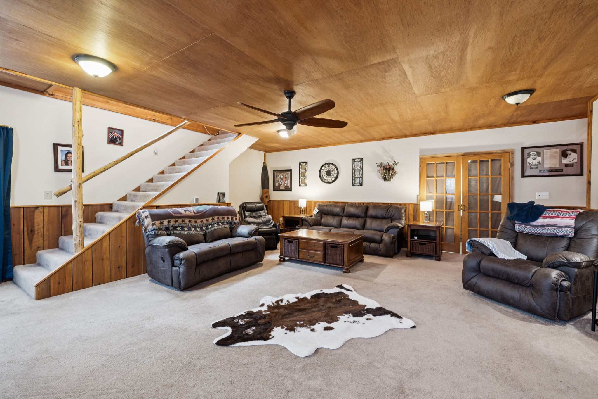 176 Robert Hensley Road Hohenwald, TN 38462 - Photo 20 of 53 a living room with furniture ceiling fan and a rug
