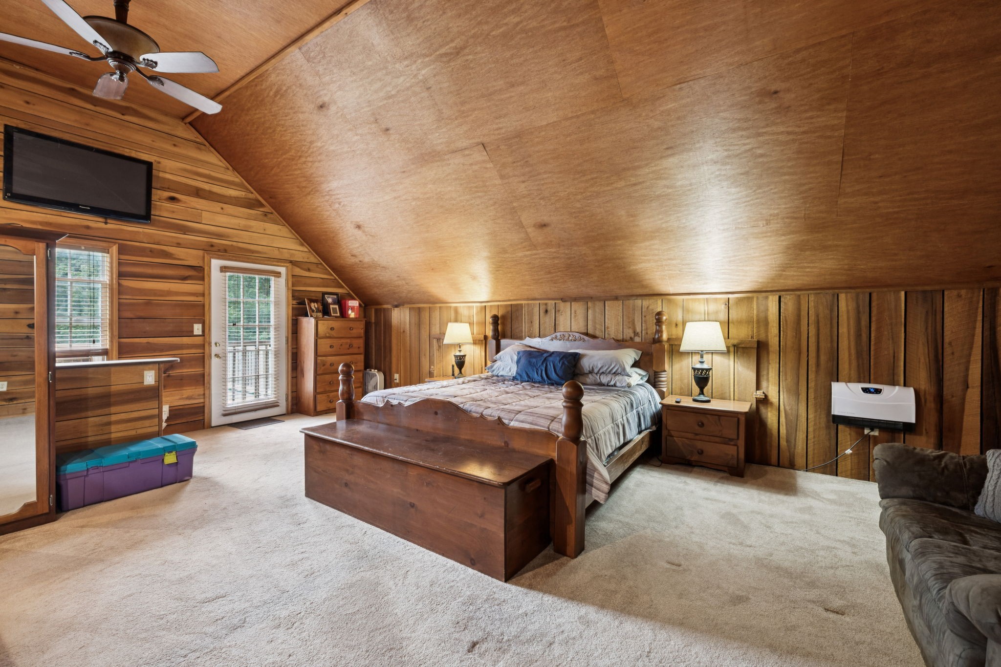 176 Robert Hensley Road Hohenwald, TN 38462 - Photo 22 of 53 a bed room with a bed and a chair