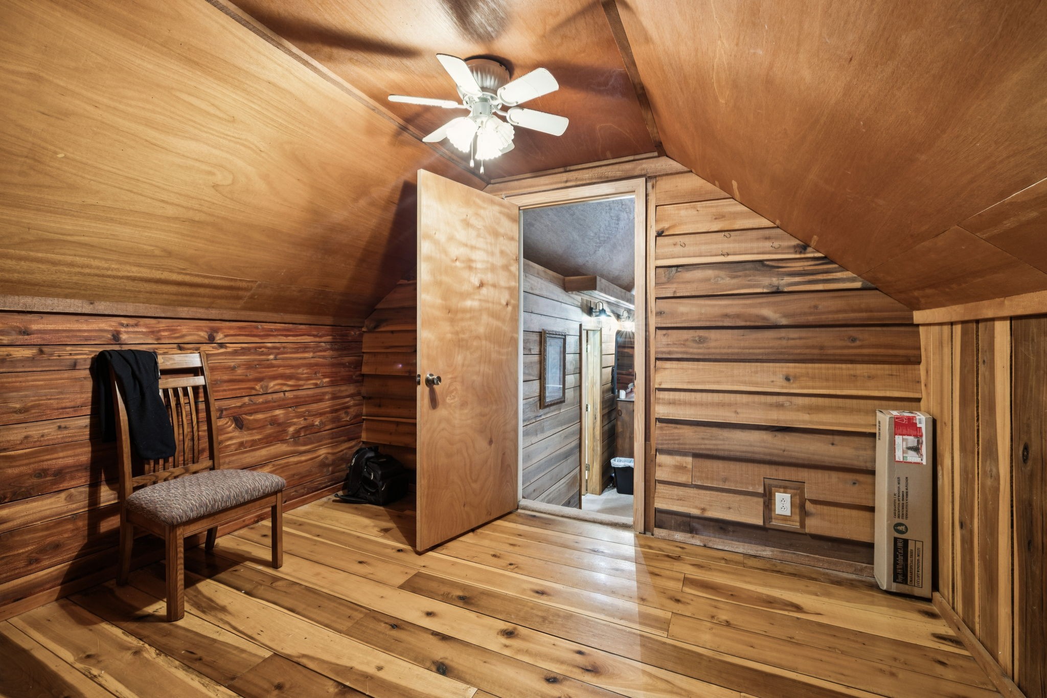 176 Robert Hensley Road Hohenwald, TN 38462 - Photo 24 of 53 a view of a livingroom with wooden floor and stairs