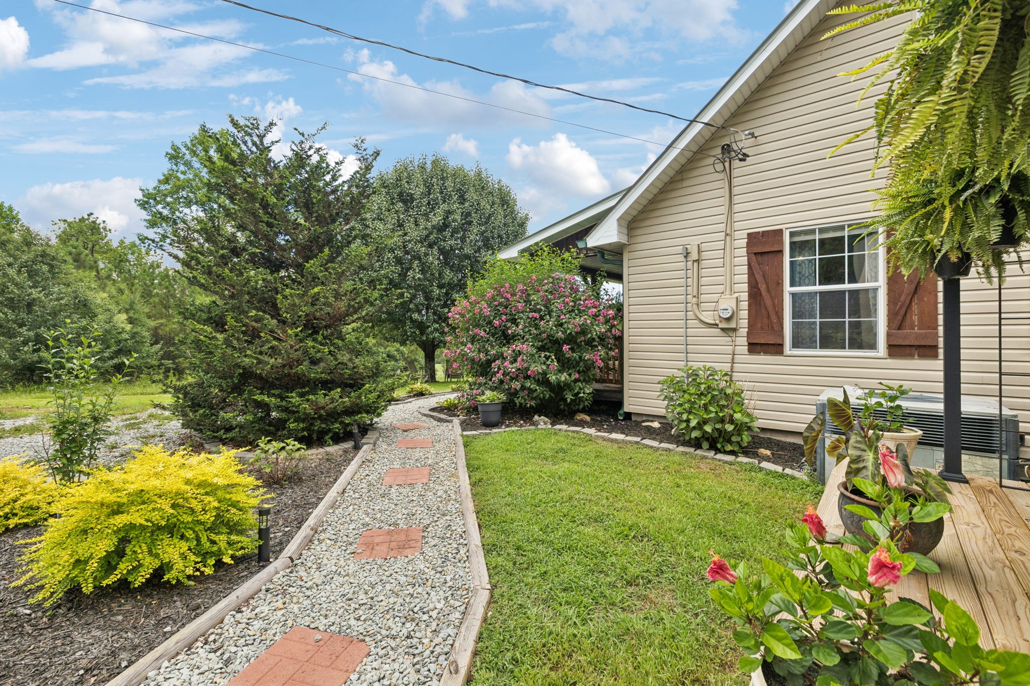 176 Robert Hensley Road Hohenwald, TN 38462 - Photo 5 of 53 a view of a garden with flower plants