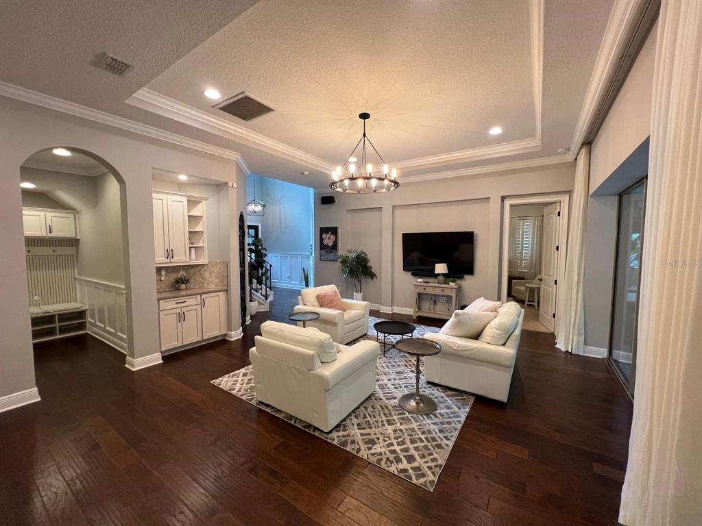 12927 Canopy Woods Way Winter Garden, FL 34787 - Photo 6 of 41 a living room with furniture and a fireplace