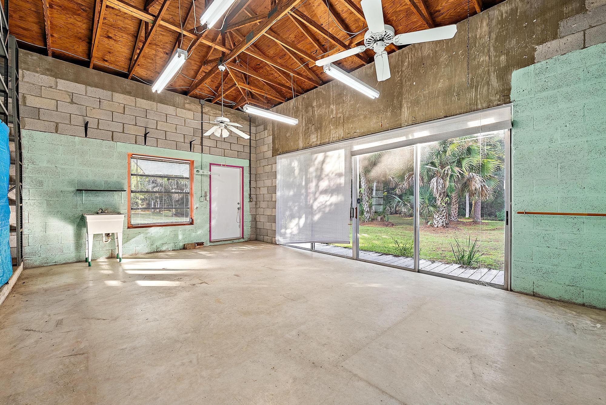 16486 95th Avenue North Jupiter, FL 33478 - Photo 26 of 34 a view of an empty room with a sliding door
