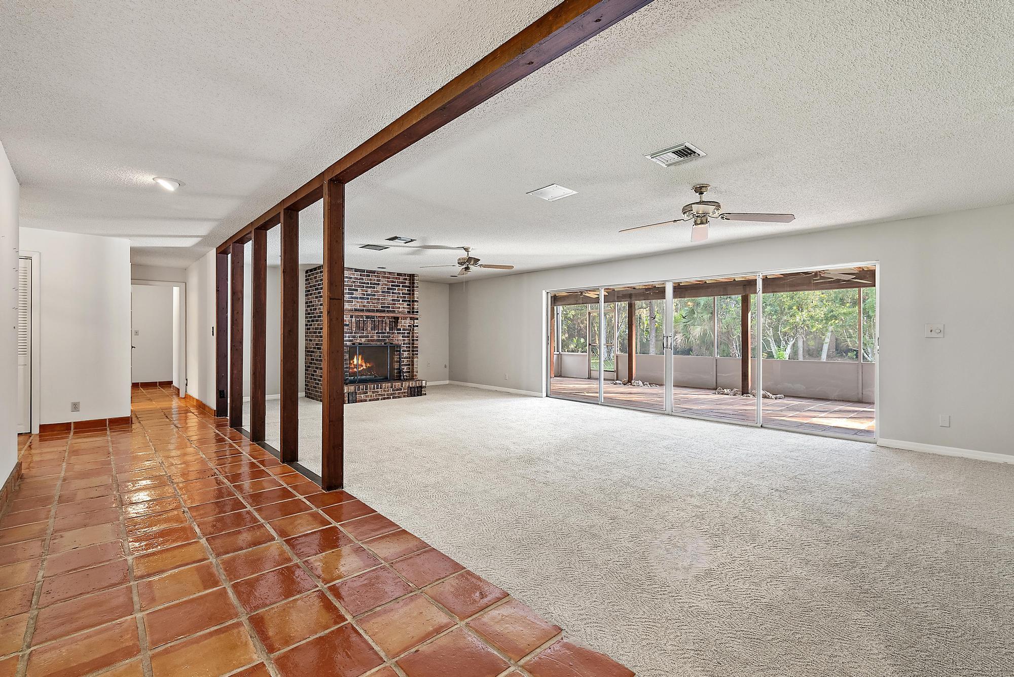 16486 95th Avenue North Jupiter, FL 33478 - Photo 4 of 34 a view of an empty room with a window