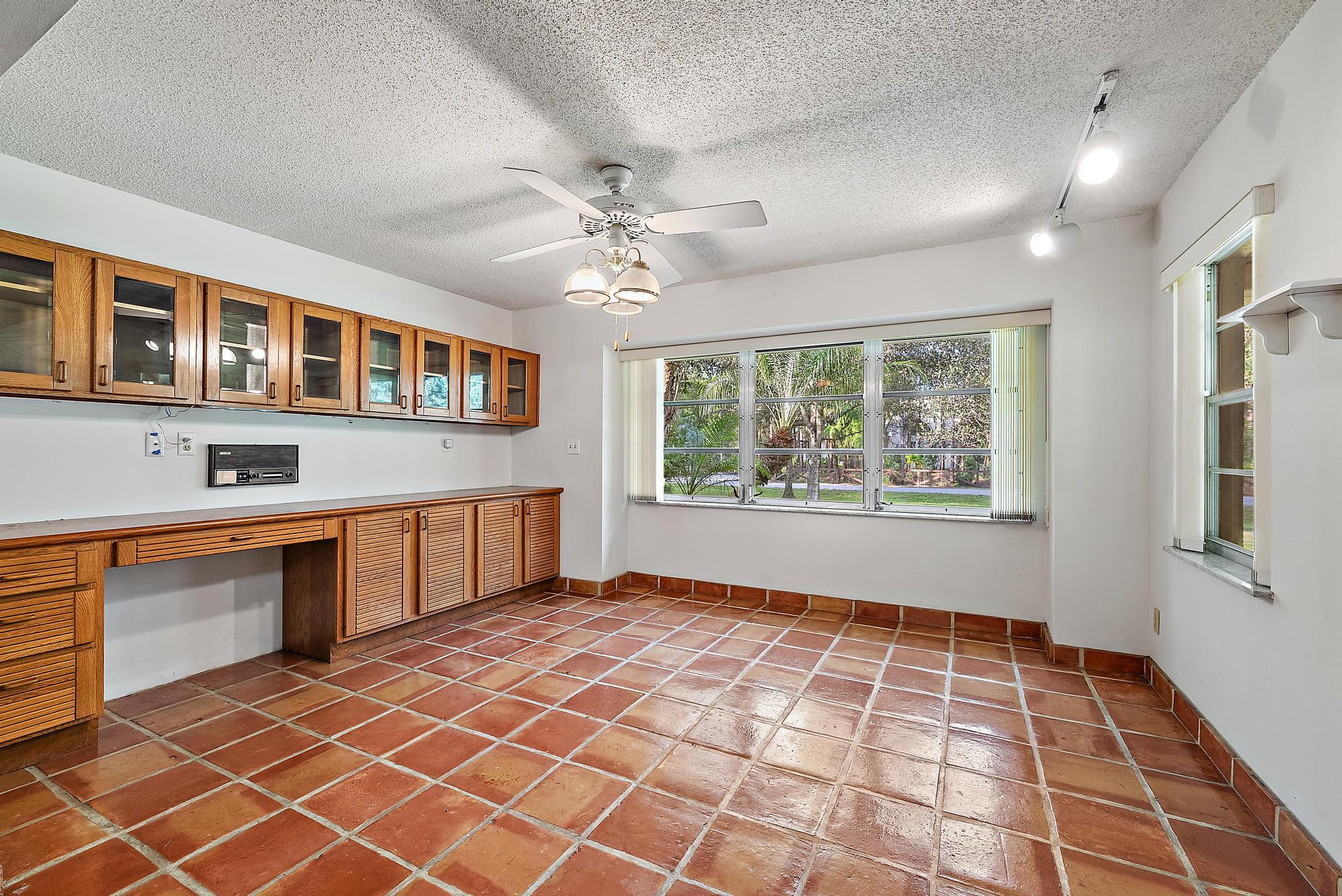 16486 95th Avenue North Jupiter, FL 33478 - Photo 9 of 34 a view of an empty room with a window